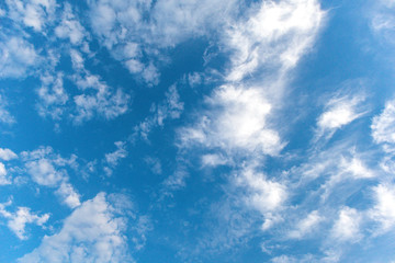 textured small clouds in the blue sky