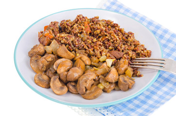 Vegetarian menu, red rice with champignons.