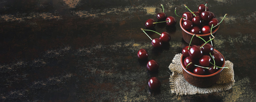 Fresh large sweet cherries. Sweet cherries in bowls. Vitamin concept.