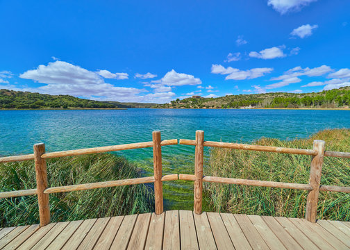 Landscape of a wood bridge and fence over the Laguna Colgada Lake in the Lagunas de Ruidera lakes Natural Parkland, Albacete province, Castilla La Mancha region, Spain