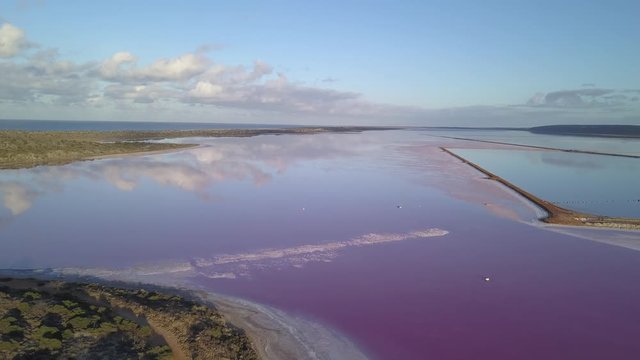 Aerial view of the Pink Lake in south west Australia. The pink lake reflects the red Australian desert sun in its clear water