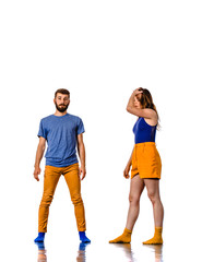 Fototapeta premium Couple of young hip-hop dancers training in studio isolated on white