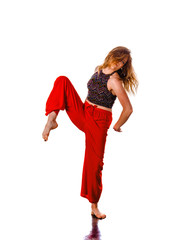 Young energetic woman dancer with athletic body exercising