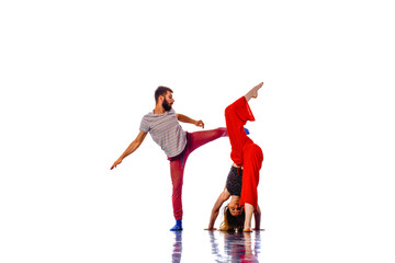 Dancing young couple on a white background