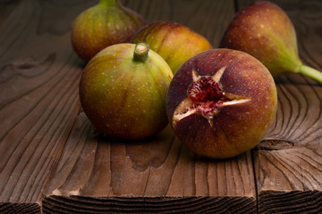 I took a picture of figs on a wooden board.