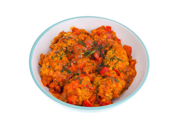 Meatballs meat, fish in tomato sauce with vegetables.