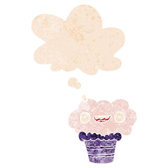 cartoon cupcake and thought bubble in retro textured style