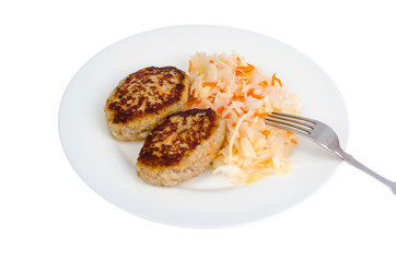Pickled cabbage with cutlets oa white plate