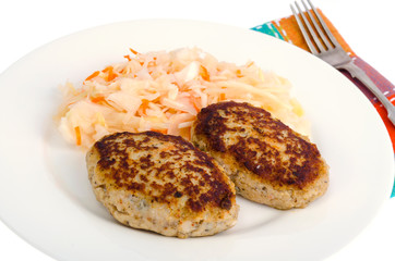 Pickled cabbage with cutlets oa white plate