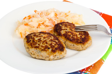 Pickled cabbage with cutlets oa white plate