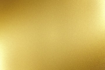 Light shining on gold metal board, abstract texture background