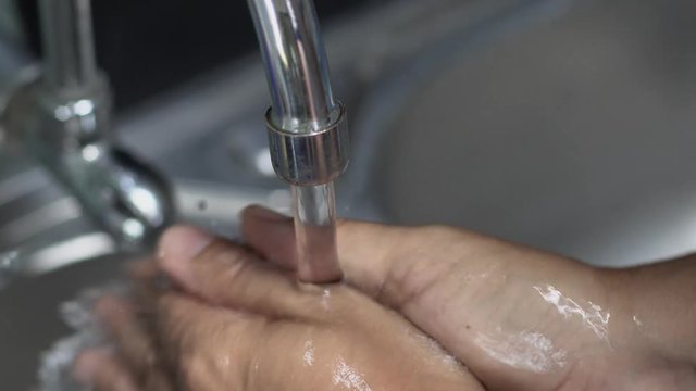 Chef washing hand in kitchen ( recorded with quality sound )