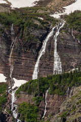 Fototapeta na wymiar Snow Melt Falls from Below Grinnell Glacier