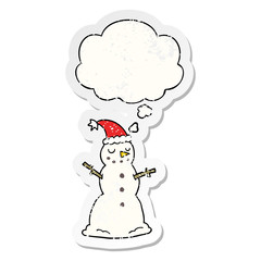 cartoon christmas snowman and thought bubble as a distressed worn sticker