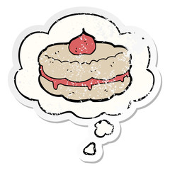 cartoon biscuit and thought bubble as a distressed worn sticker