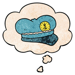 cartoon sailor hat and thought bubble in grunge texture pattern style