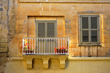 close up retro style old house window of Mediterranean architectural culture in Mediterranean island Malta