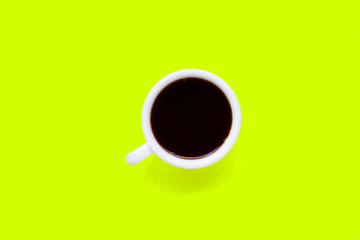  Hot black coffee on  green yellow background.