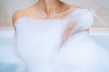 woman shower and relaxing in bathtub