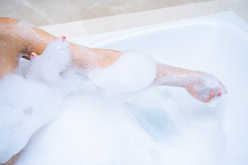 woman shower and relaxing in bathtub