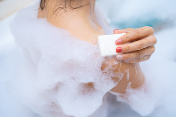 woman shower and relaxing in bathtub