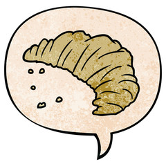 cartoon croissant and speech bubble in retro texture style