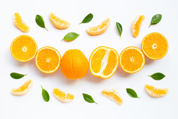 High vitamin C. Fresh orange citrus fruit with leaves isolated on white background.
