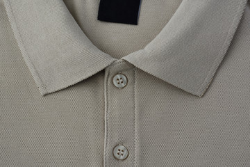 Light brown polo t-shirt.