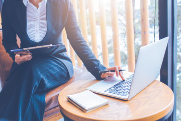 Businesswomen are working using computer in office.