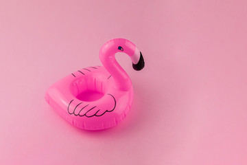 Pink floating Flamingo on pastel pink background. Summer minimal concept. 