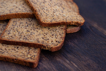 Bread slices on wooden oak table