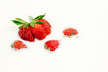 Red natural ripe strawberries in milk cream