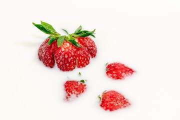 Red natural ripe strawberries in milk cream