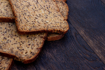 Bread slices on wooden oak table