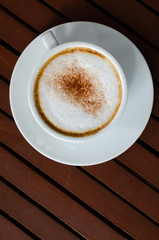 cup of coffee on wood table.