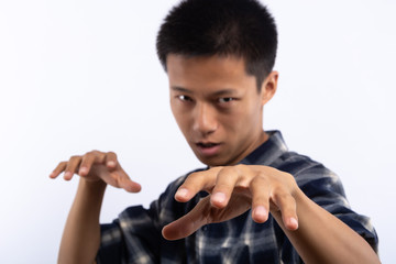 Closeup portrait of young handsome man face expressing astonishment and admiration in studio on...