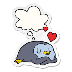 cartoon penguin in love and thought bubble as a printed sticker