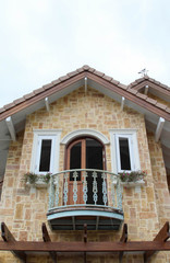 Fototapeta premium Decorative window and balcony on the second floor.