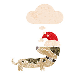 cartoon dog wearing christmas hat and thought bubble in retro textured style