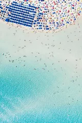 Cercles muraux Plage de La Pelosa, Sardaigne, Italie Stunning aerial view of the Spiaggia Della Pelosa (Pelosa Beach) full of colored beach umbrellas and people sunbathing and swimming in a beautiful turquoise clear water. Stintino, Sardinia, Italy.