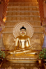 Obraz premium gold buddha statue sit action on another bhudda on asian art background