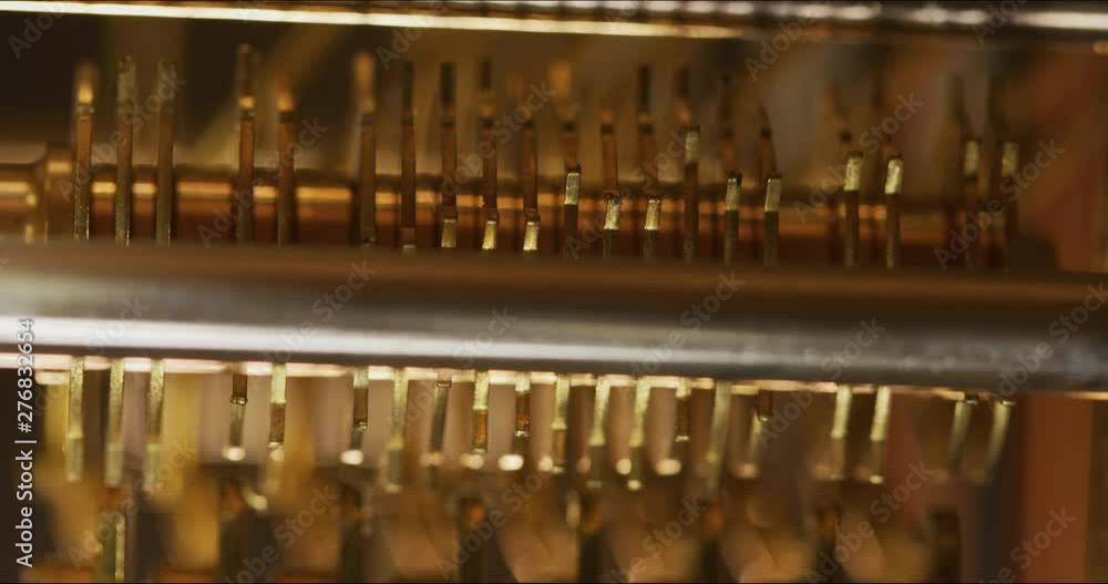 Poster inside macro shot of a working clock mechanism as it keeps time. codec prores 422 10 bit 4096 x 2160