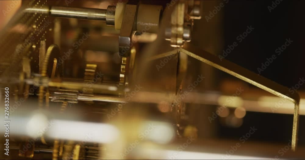 Poster inside macro shot of a working clock mechanism as it keeps time. codec prores 422 10 bit 4096 x 2160
