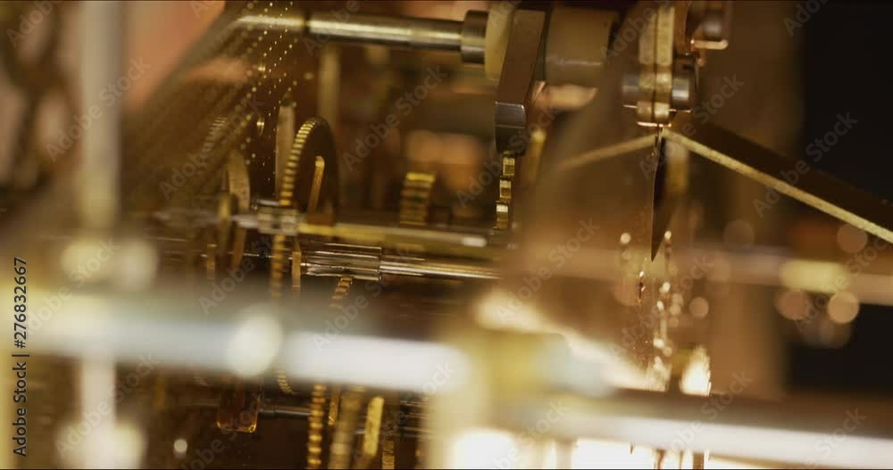 Poster inside macro shot of a working clock mechanism as it keeps time. codec prores 422 10 bit 4096 x 2160