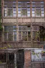 broken down wooden house facade in tbilisi