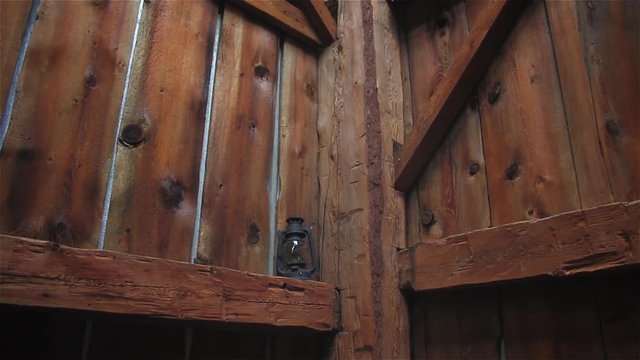 The corner of an old, wooden barn