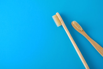 Bamboo toothbrush on blue background