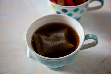 cup of coffee with sugar on table