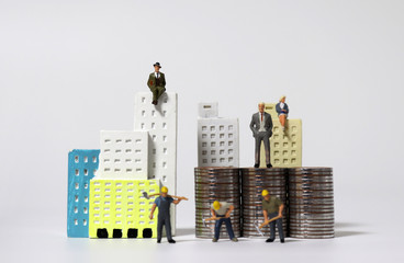 Miniature houses and miniature people. The concept of social and position inequality.