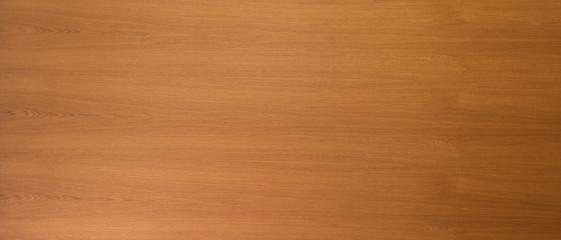 Close up on light brown smooth wooden grain veneer
